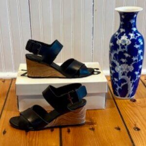 Vince Gwyn leather crisscross open-toe slingback wedge sandal in black. Size 7